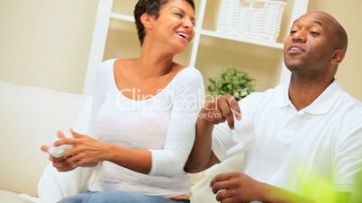 Ethnic Couple Having Fun with Games Console