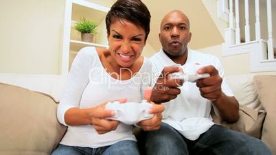 Pretty Ethnic Girl Beating Boyfriend on Games Console