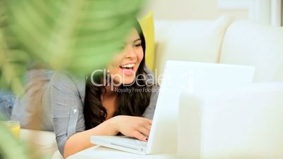 Young Girl at Home Using Laptop