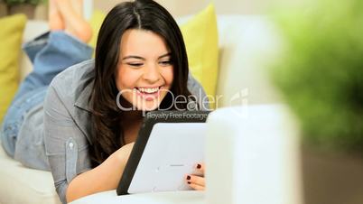 Brunette Girl Using Wireless Tablet at Home