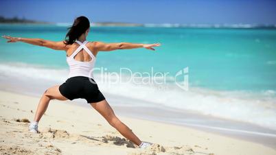 Healthy Female Doing Stretches on the Beach