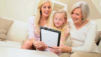 Cute Little Grand-daughter Being Shown a Wireless tablet