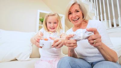 Cute Girl & Grandma Playing on Games Console