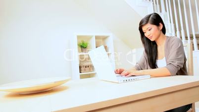 Asian Girl at Home With Laptop