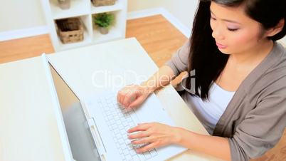 Young Girl Working on a Laptop