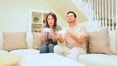 Caucasian Couple Playing on Games Console