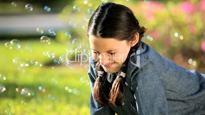 Young Caucasian Girl with Play Bubbles