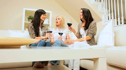 Three Pretty Girls Relaxing with Glass of Wine