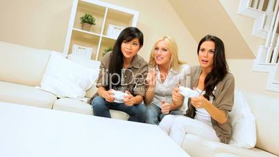 Trio of Multi-Ethnic Friends with Electronic Games