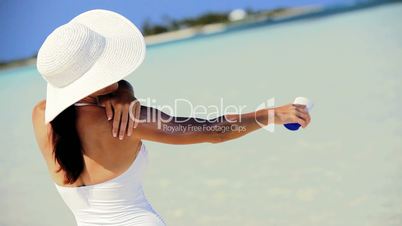 Slim Caucasian Female Using Sun Protection Cream