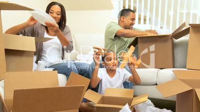 Happy Family Unpacking After House Move