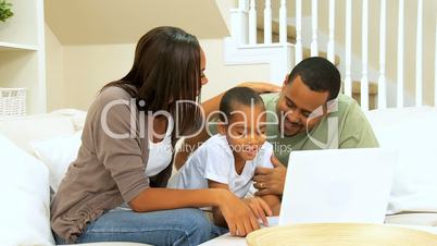 African American Family Using a Laptop
