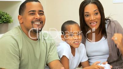 African-American Family Playing on Games Console