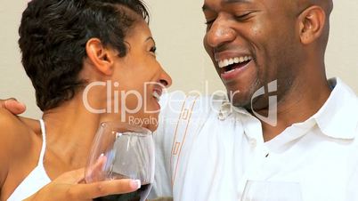 Happy Ethnic Couple Drinking Wine in Close-up