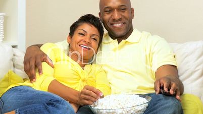 African-American Couple with Popcorn Watching TV