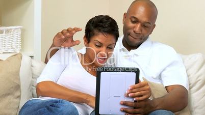 African-American Couple Using Interactive Technology