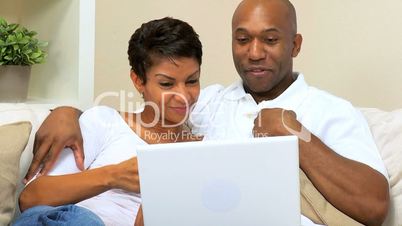 Ethnic Couple Talking to Friends Via Webchat