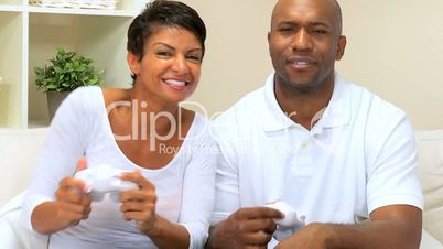 African-American Couple Using Games Console