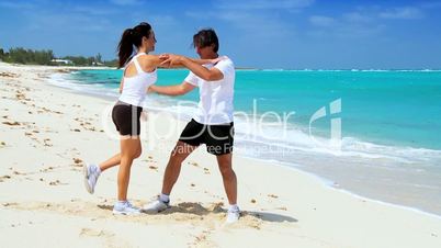 Couple Exercising on the Beach
