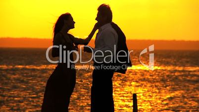Elegant Couple at Sunset with a Glass of Wine