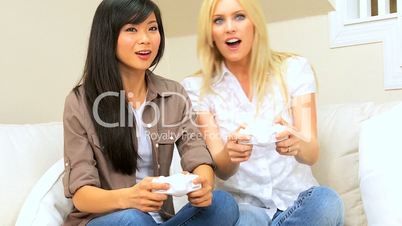 Girlfriends Enjoying Electronic Games