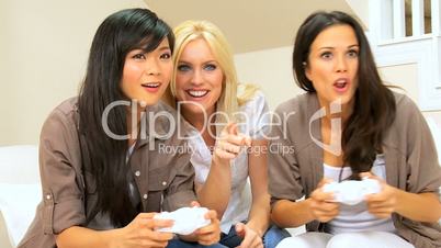 Three Multi-Ethnic Females Playing Electronic Games