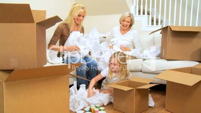 Family Females Playing with  Tissue from Moving Cartons