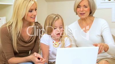 Family Females with Laptop at Home
