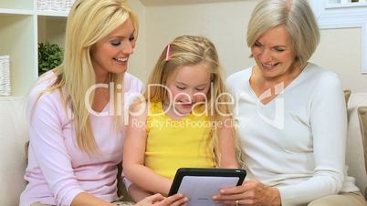 Three Generations of Females with Wireless Tablet