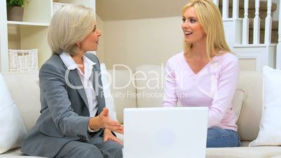 Female Client Meeting with Financial Advisor at Home