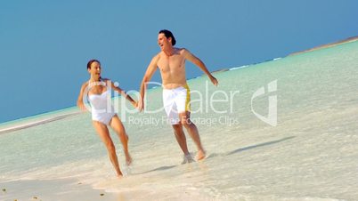 Happy Couple in Swimwear on Luxury Island Vacation