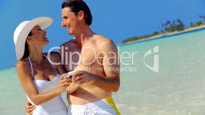 Couple with Camera on Beach Vacation