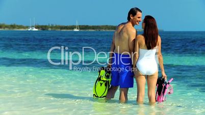 Attractive Couple Preparing to go Snorkeling