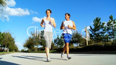 Husband Encouraging Wife in Fitness Training
