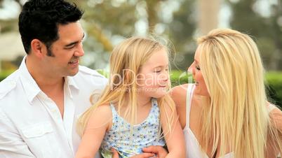 Little Girl With Multi-Ethnic Parents in Park