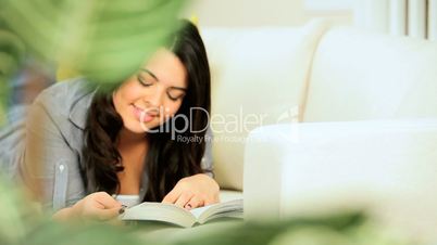 Pretty Young Girl Relaxing With a Book