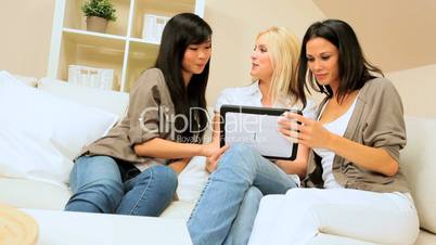 Three Girlfriends Using  Wireless Tablet
