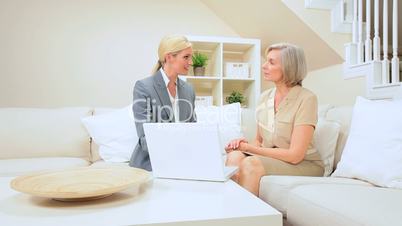 Senior Lady Client Having Financial Advice at Home