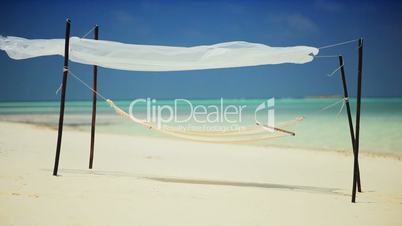 Hammock Swaying over Tropical White Sands