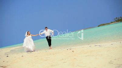 Happy Wedding Couple Dancing in the Ocean