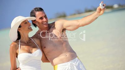 Caucasian Couple in Swimwear with Camera