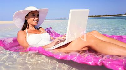 Caucasian Female Using Laptop on Inflatable Mattress