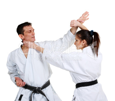 Karate. Young girl and a men in a kimono