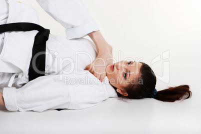 Karate. Young girl in a kimono