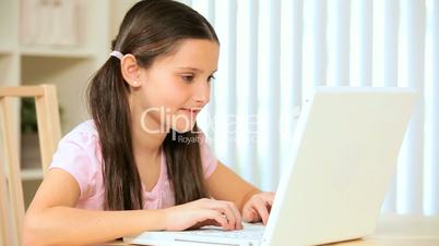 Young Girl Playing on Laptop