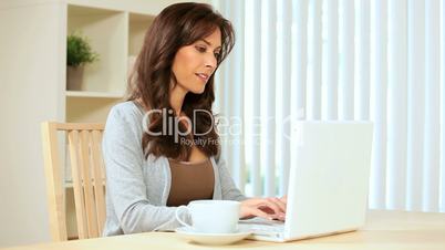 Family Looking at Laptop at Home