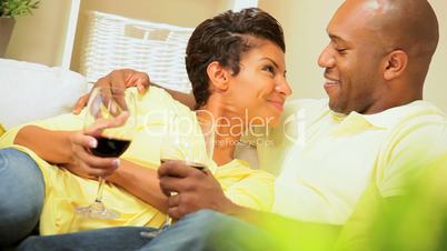 Young Couple Relaxing at Home Drinking Wine