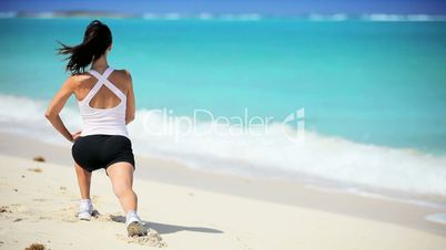 Attractive Female Exercising on the Beach