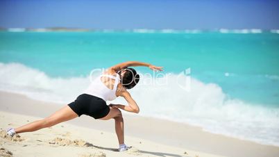 Attractive Female Exercising on the Beach