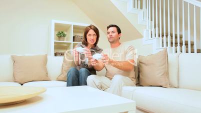 Young Couple Playing Electronic Games